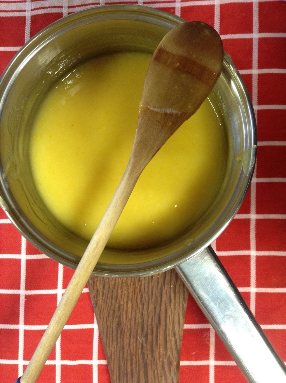 When mixture is a lovely yellow colour and thick enough to draw a line on the back of your spoon it is ready to go into your container of choice. Please take care pouring hot liquids into glass jars!