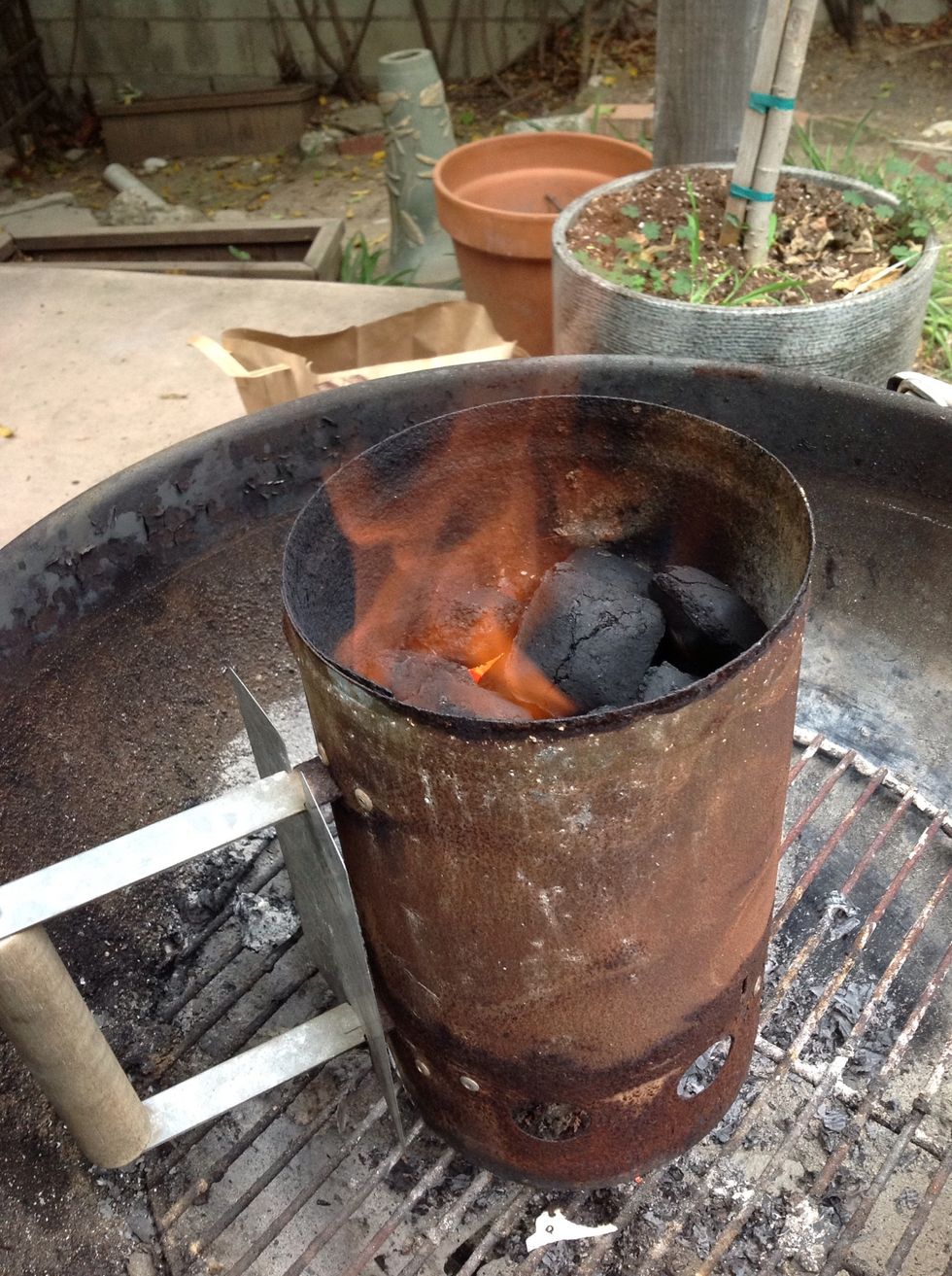 When most of the charcoal is hot (about 15 minutes), flames will rise above the chimney.