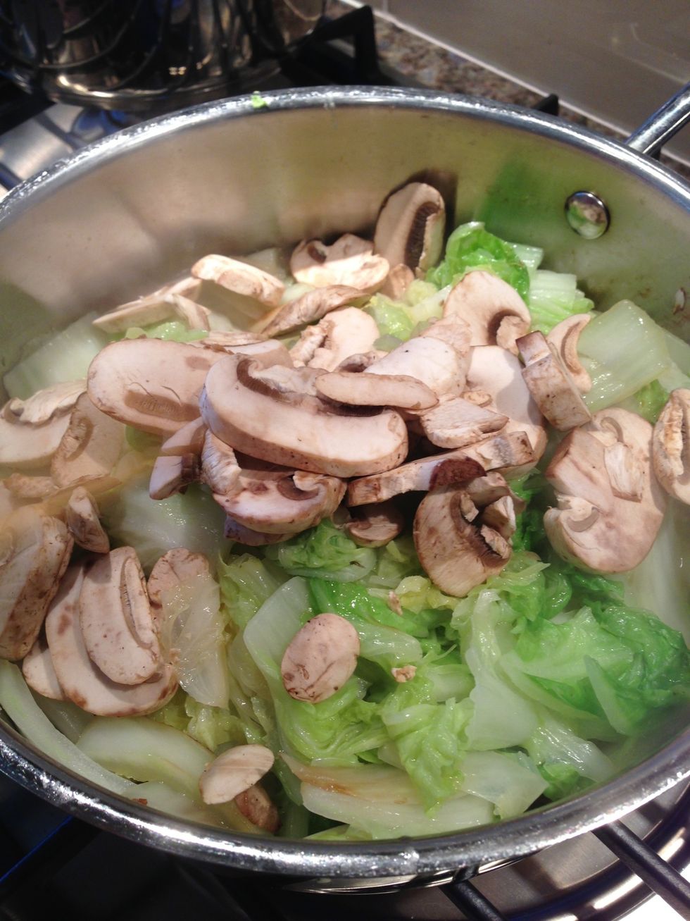 When napa is done, add mushrooms