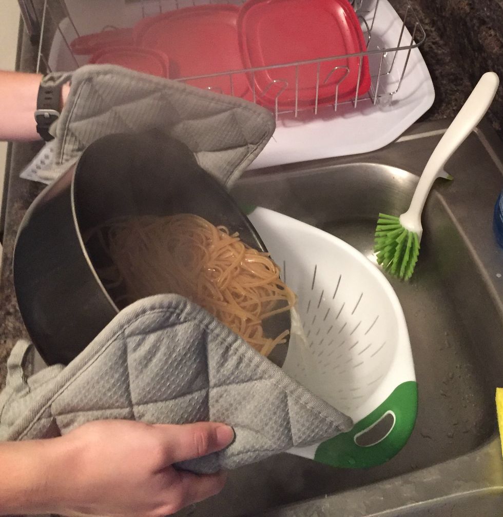 When noodles are ready, use pot holders to carry pot to sink and dump noodles and water in strainer. Tip: tilt the pot away from you so steam doesn't go in your face