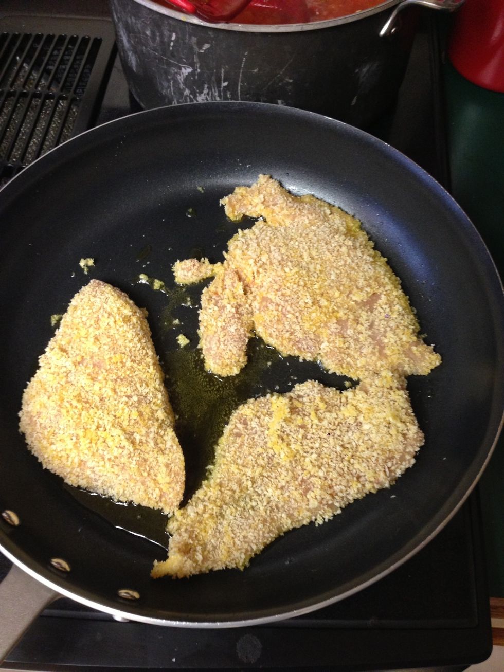 When oil is hot, add breaded chicken