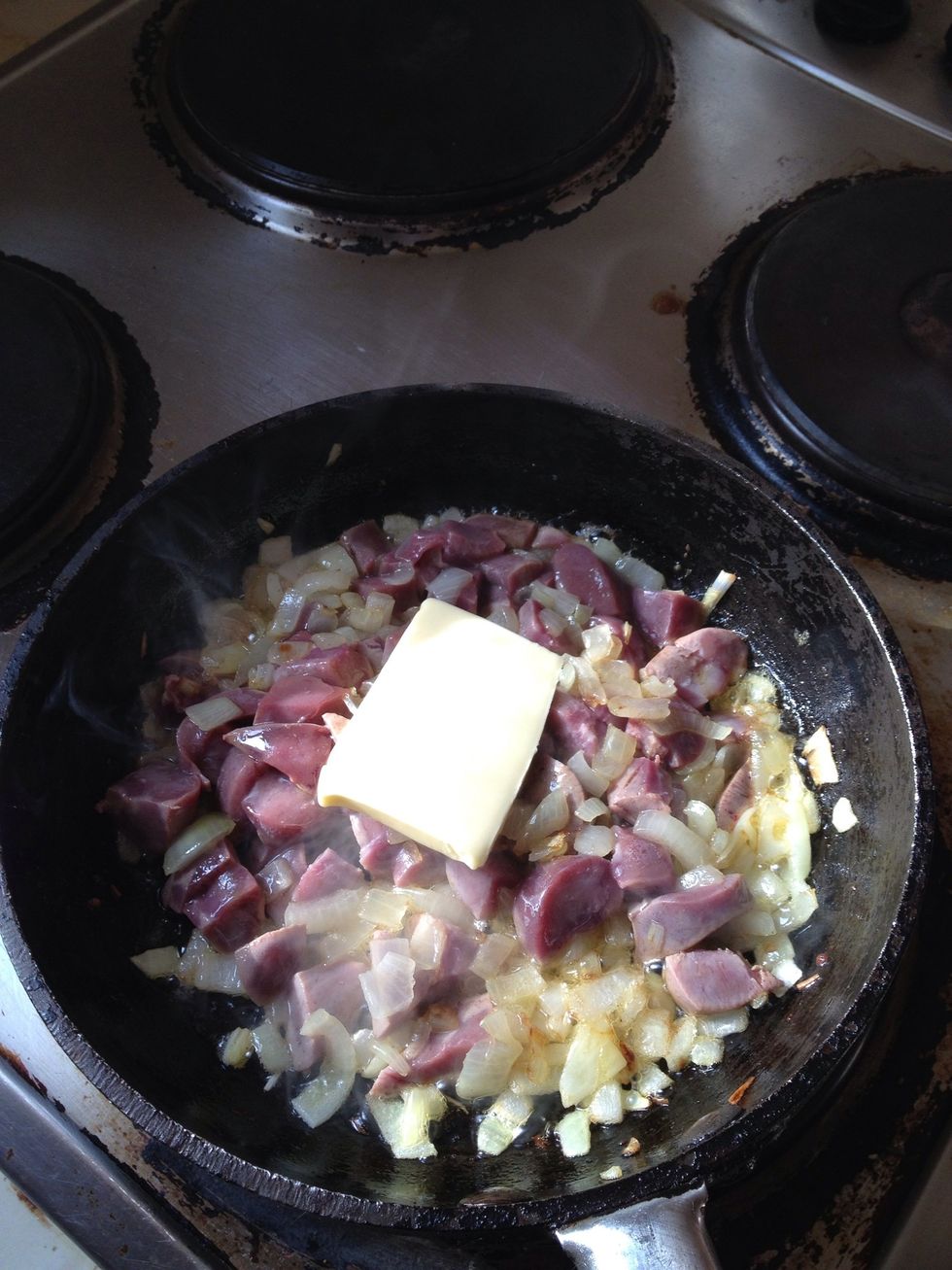 When onions are softened, couple of minutes or so, add the cubed kidney, if its a bit dry add another smaller knob of butter