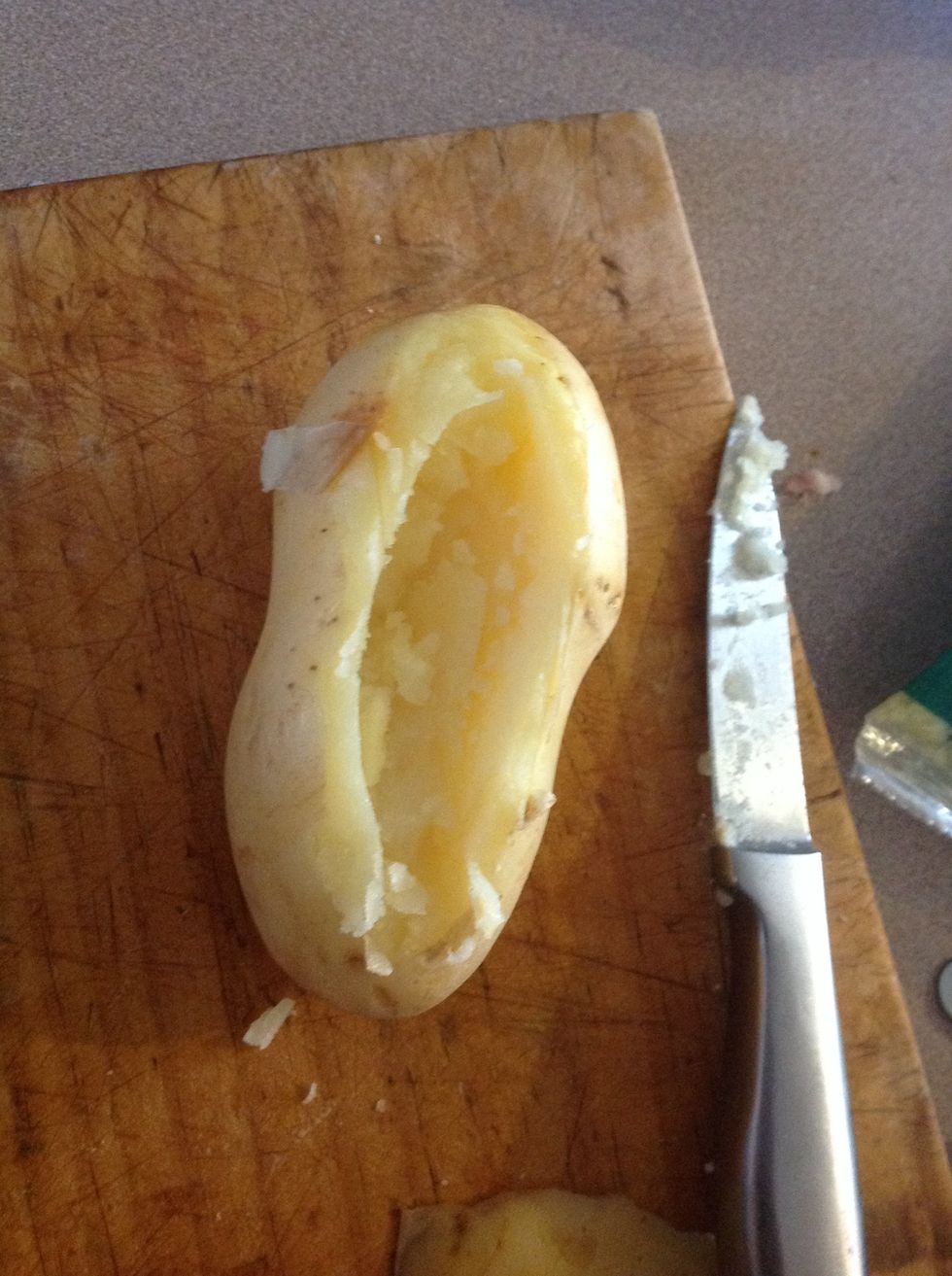 When potatoes are cooked make a hole and scoop the flesh out with a spoon. Scoop out as much as you want
