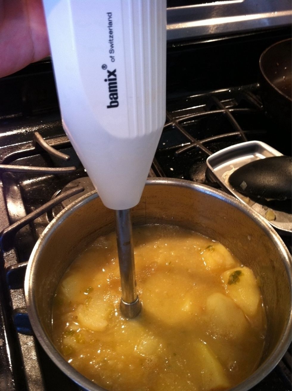 When potatoes are tender, use immersion mixer to mash the potatoes til smooth. Or when using a blender, allow soup to cool a bit, blend in parts , then return to pot. You may also use a potato masher.