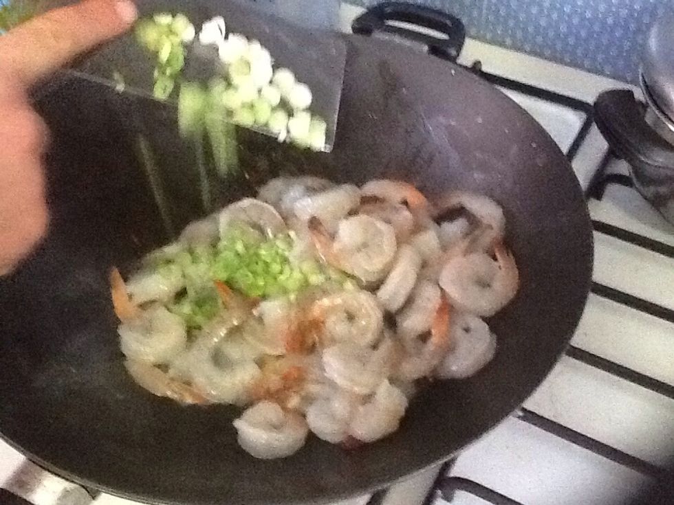 When prawns are cooked, add spring onion