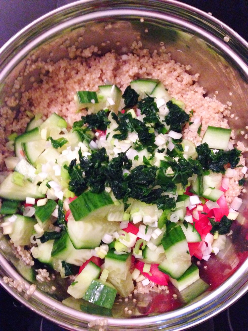 When quinoa is cooked add tomatoes, cucumber, scallions and parsley.