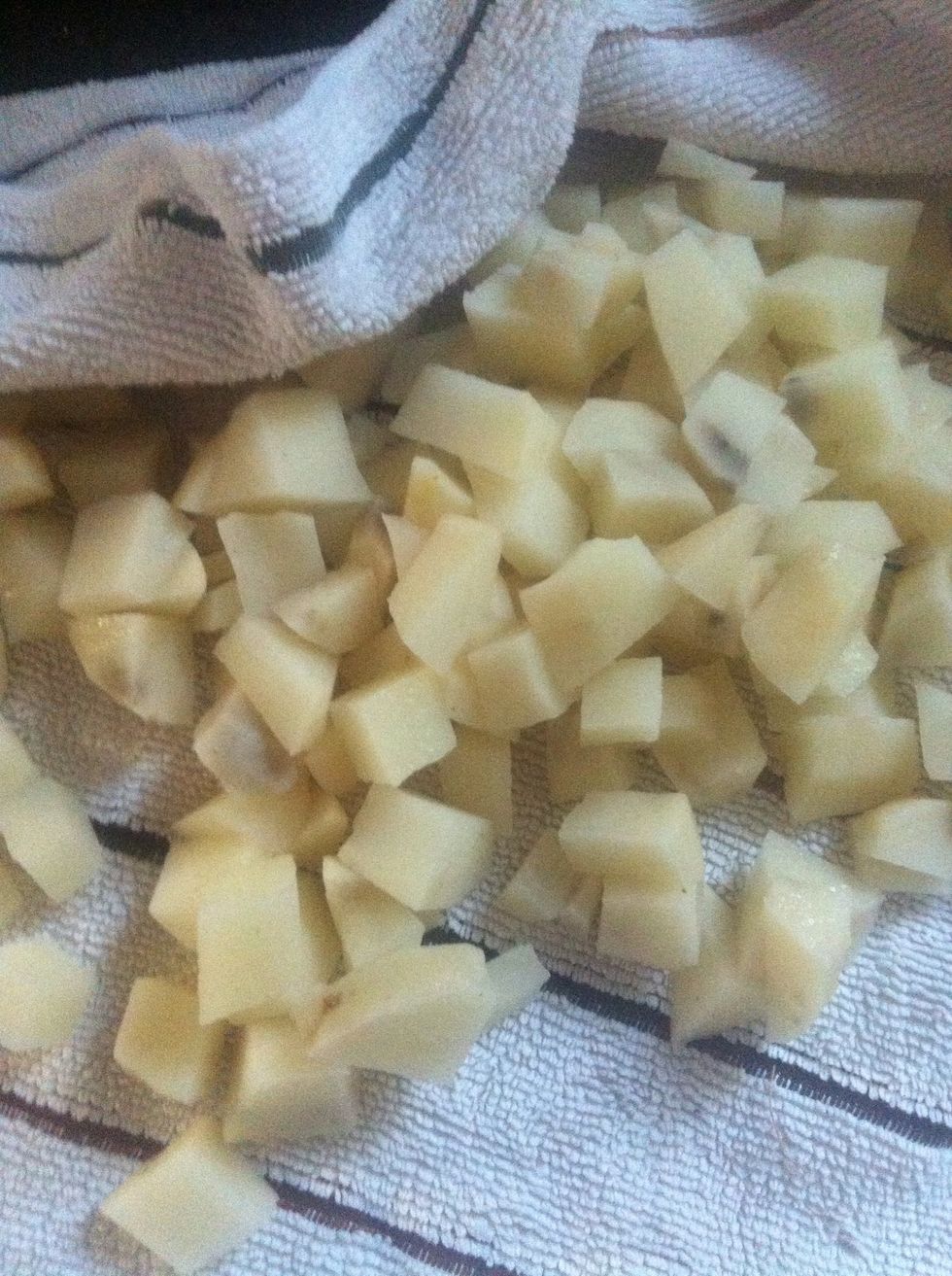 When ready to fry, dry the soaked potatoes in your dish towel.