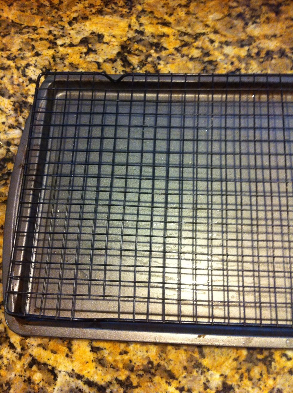 When ready to pour ganache over, I place a small cooling rack over the pan and place roll atop this. That way the ganache drips off and is easy clean up