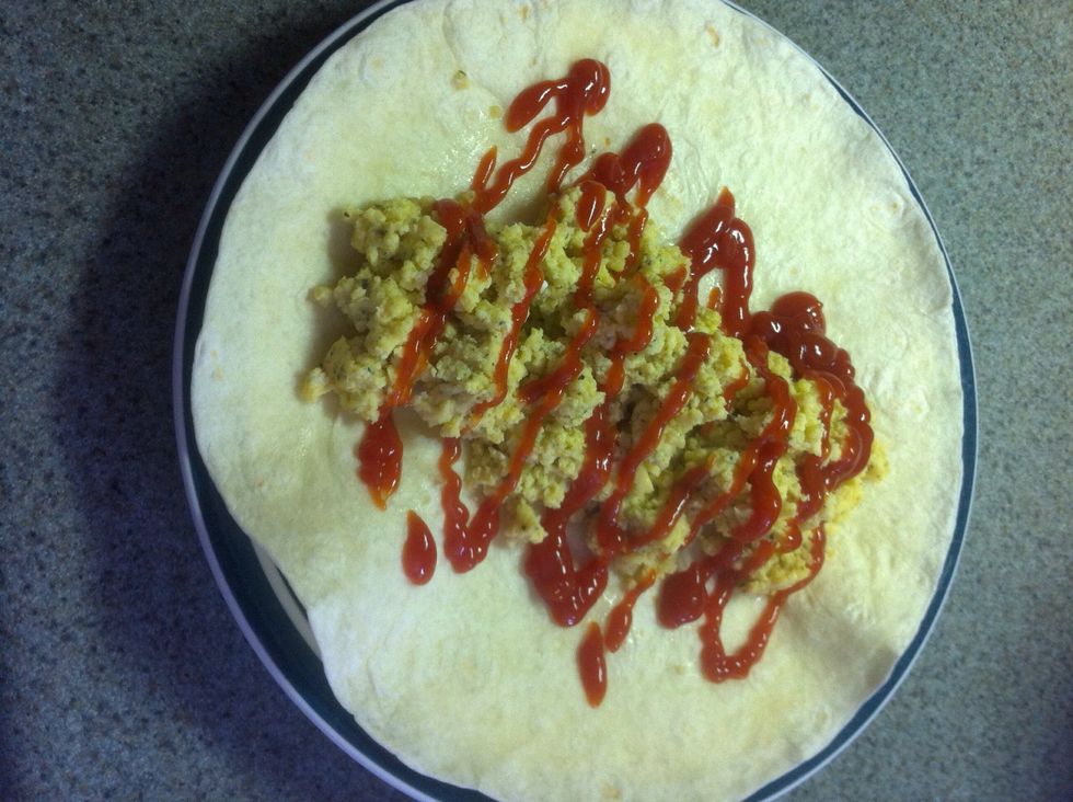 When scrambled place in centre of tortilla and if wanted and some sauce.