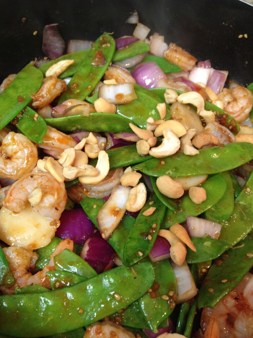 when shrimp is cooked, add water chestnuts, cashews, and pineapple. cook for five more minutes. you can add soy vay, soy sauce, and sriracha to taste.