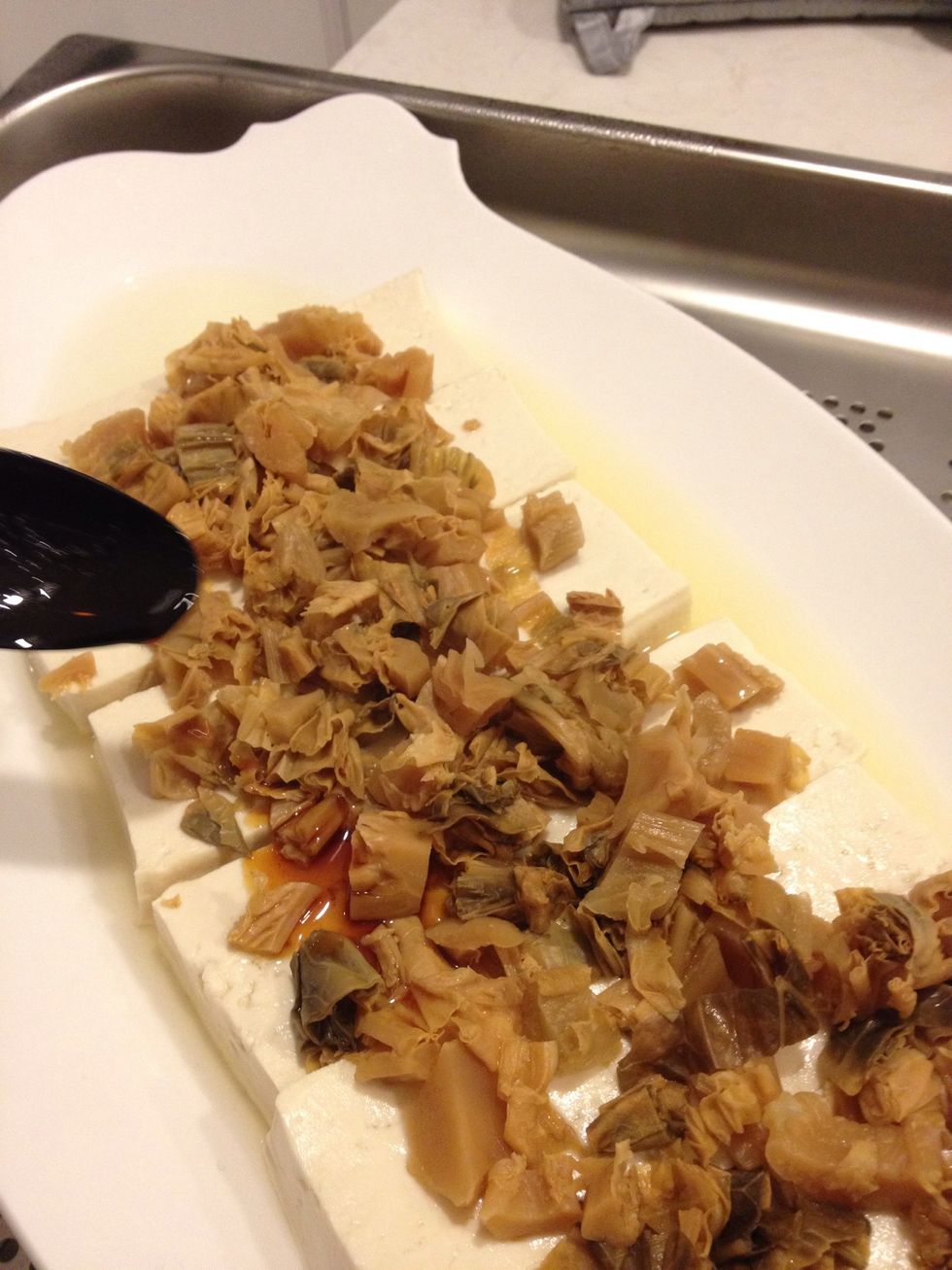 When steaming is done, add the sweet soya sauce to the bean curd.