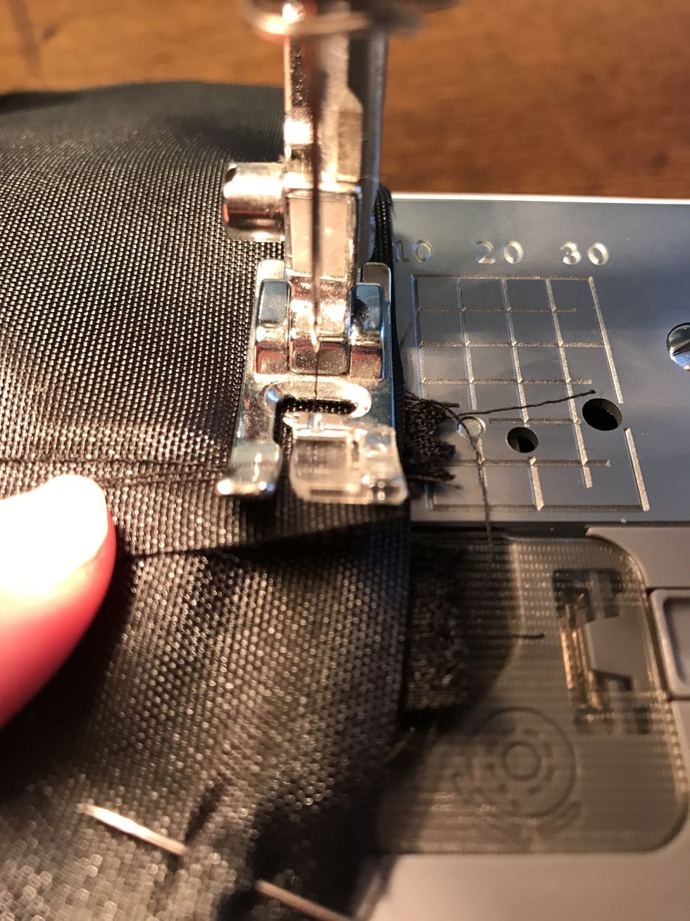 When stitching the tops (near the zipper) please use the hand wheel to pass the metal zipper. If your needle hits the zipper it could break. Please be very careful.