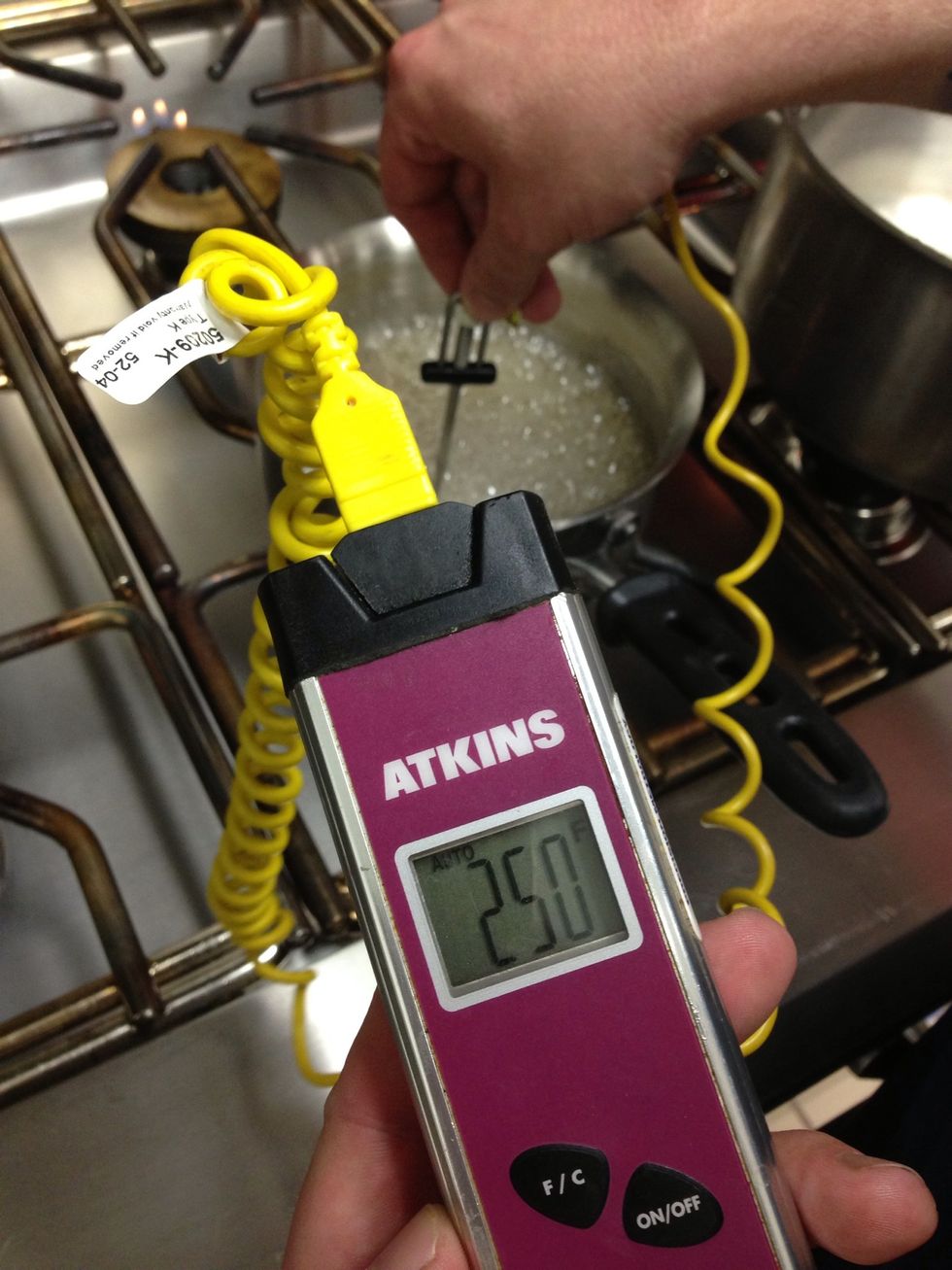 When sugar/water combination reached 250F (121C), remove from heat.