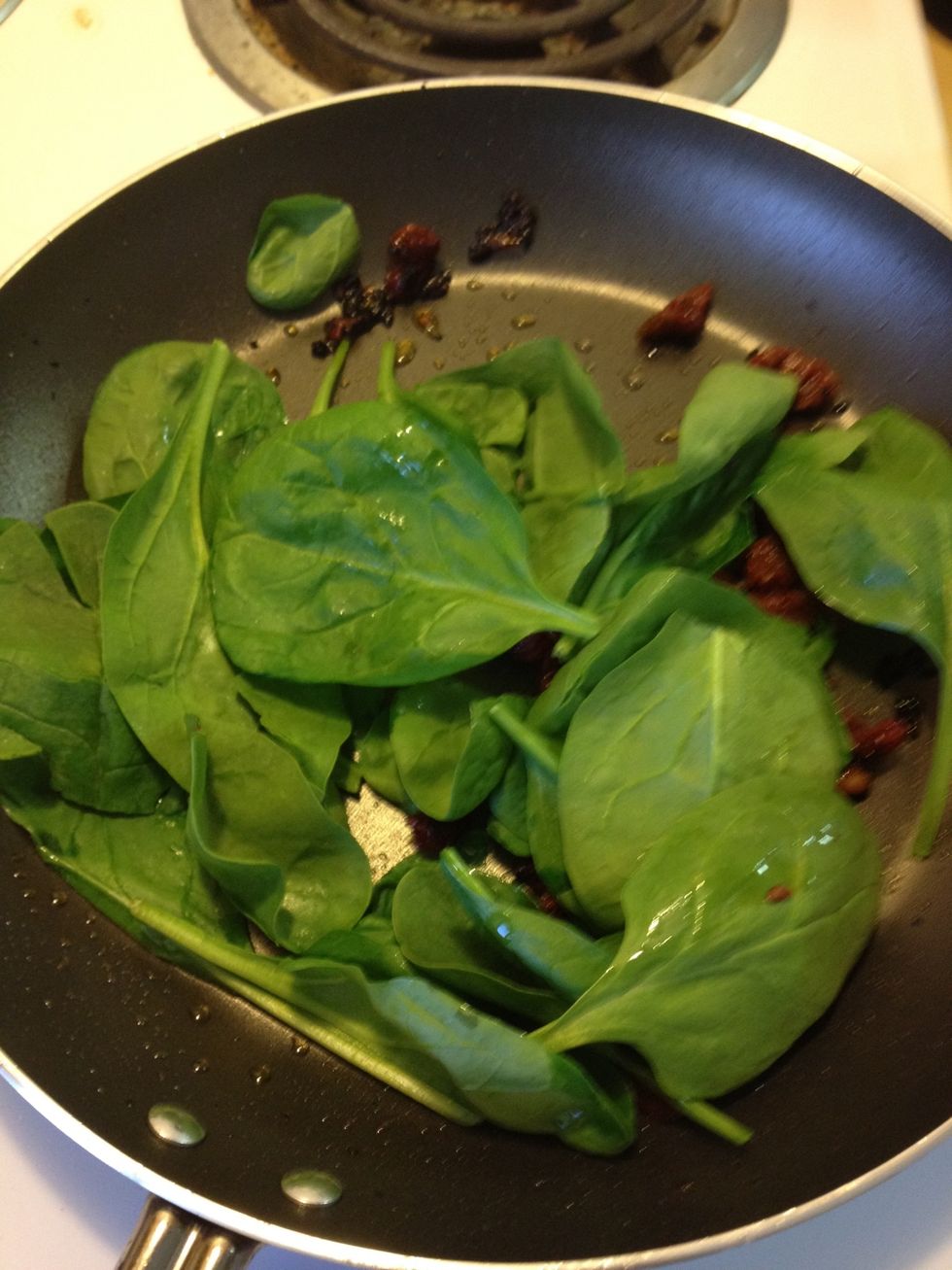 When sun-dried tomatoes are cooked, remove from heat and add spinach to pan. You don't want to cook the spinach but just heat it up.