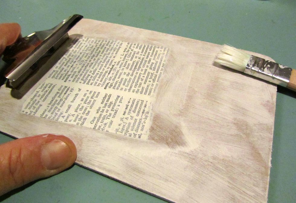 When that is dry add some pieces of dictionary page randomly and cover with a sealer like mod podge.