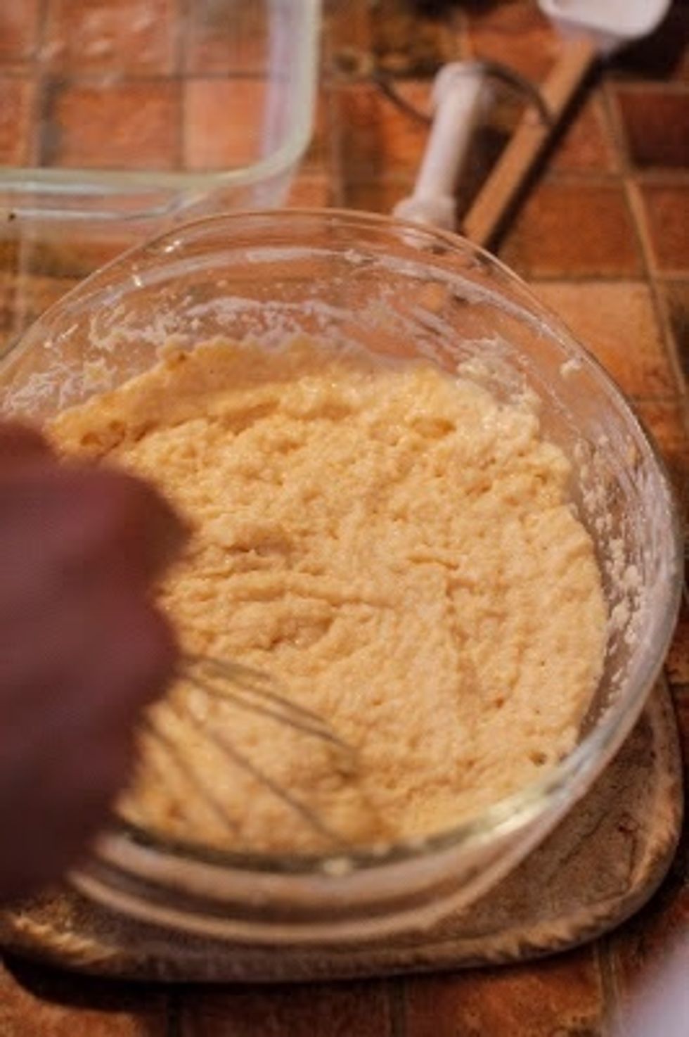 When the 5 minutes have passed, take the ricotta and condensed milk out and mix it up well.