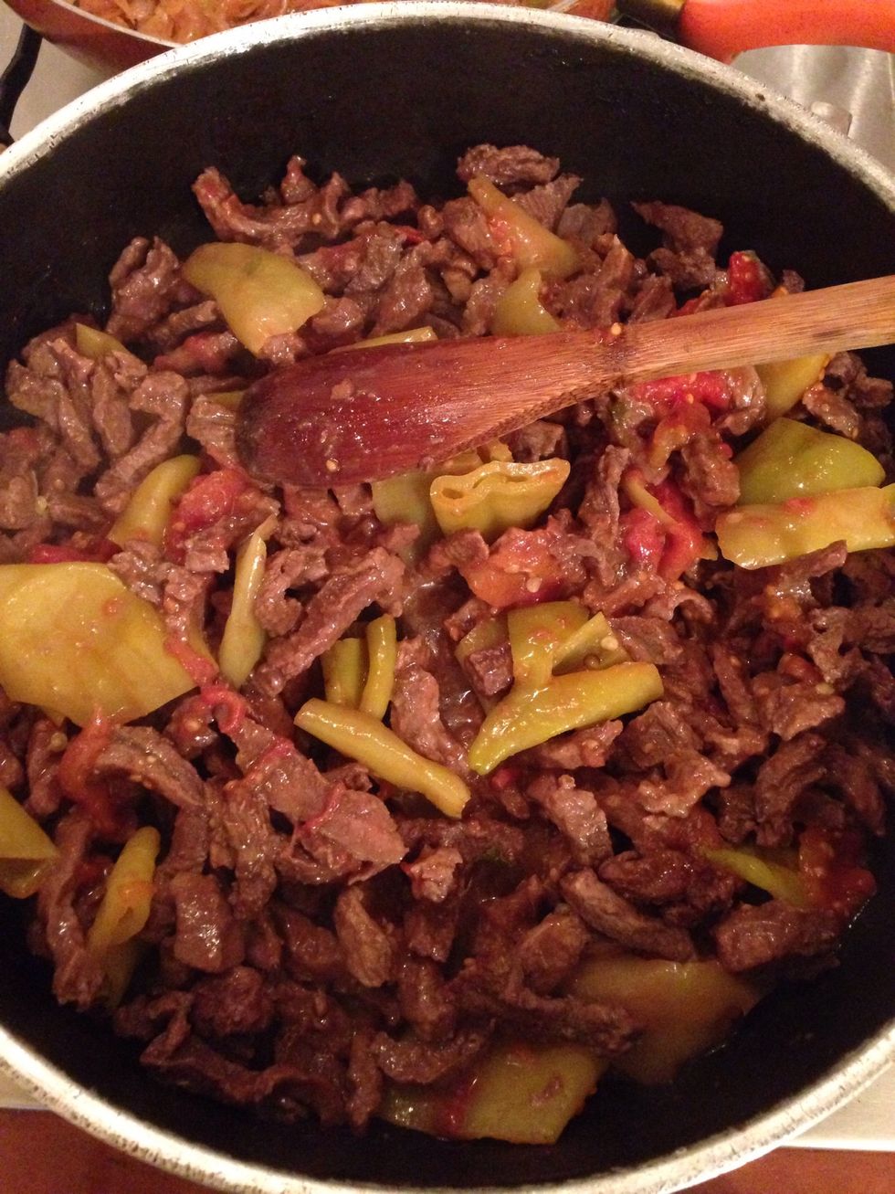 When the beef is cooked add the canned tomato and pepper