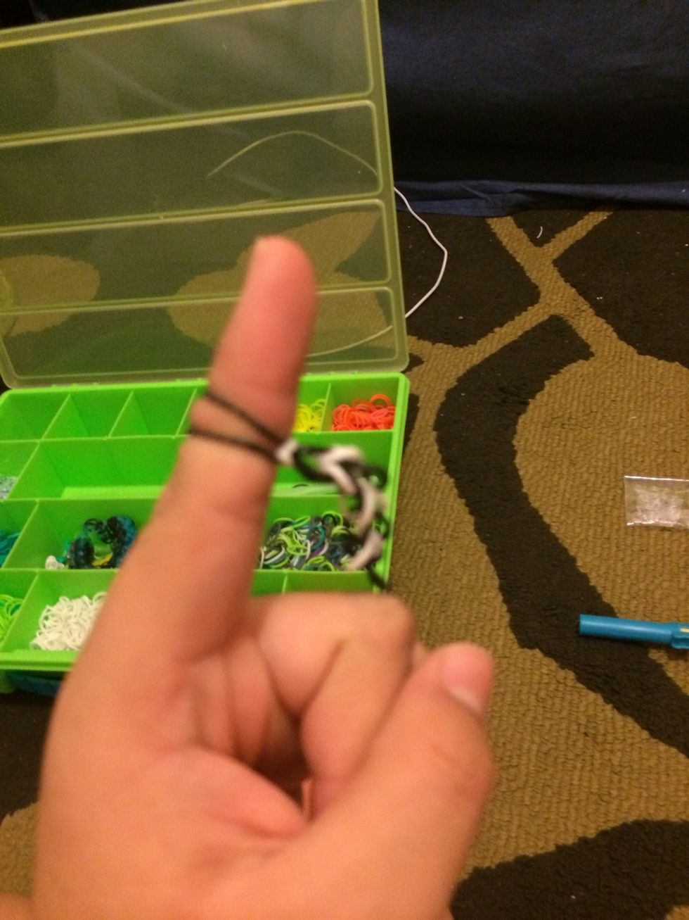When the bracelet is at a good length, transfer the bands on one finger/pencil