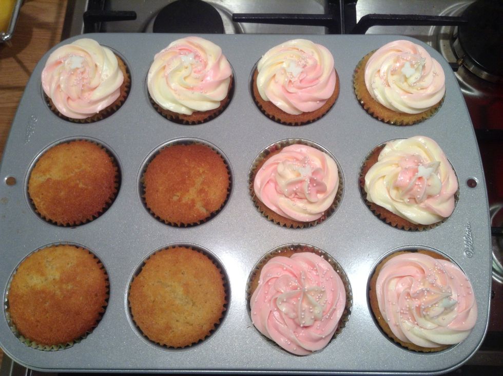 When the butter cream is ready I mixed half with pink food colouring. Fill a piping bag with half pink and half white and pipe away :-)