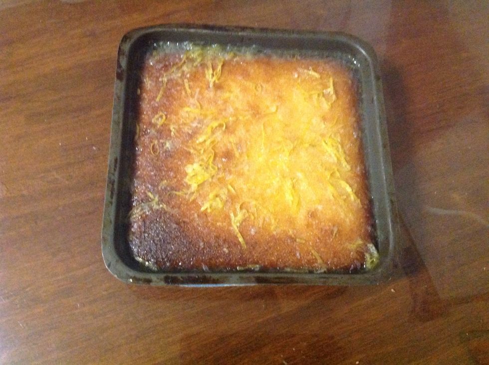 When the cake is cooked take it out of the oven and pour the dextrose and lemon mix on top immediately. Then leave the cake to cool completely in the tin.