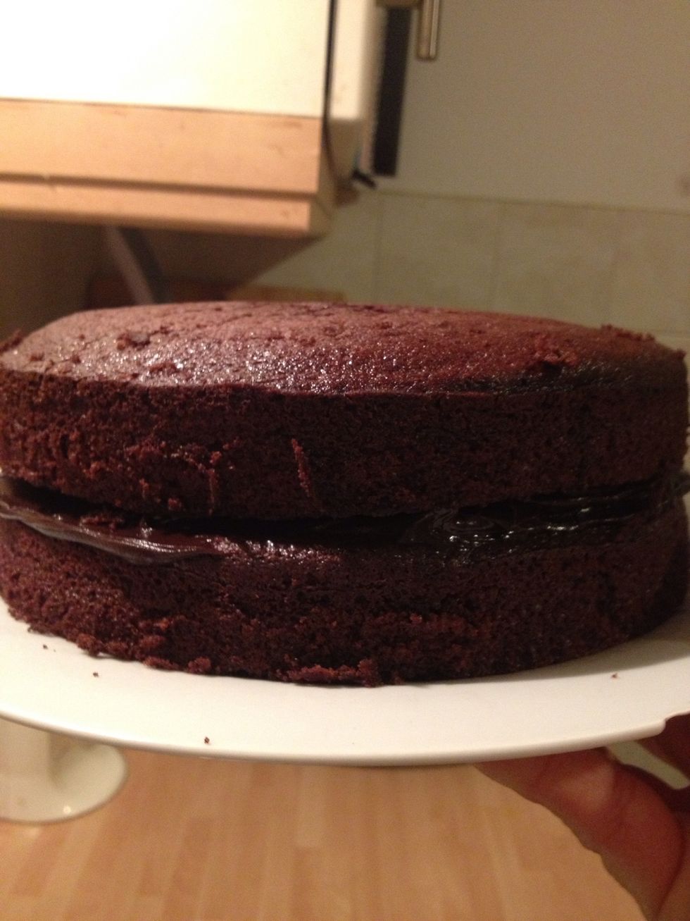 When the cakes and frosting have completely cooled, your ready to build the cake! Make sure the frosting has set so it's stiff, otherwise it'll slide around everywhere.
