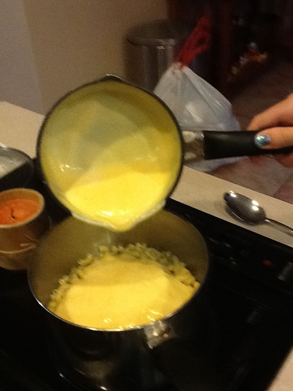 When the cheese is melted, pour over pasta and mix.