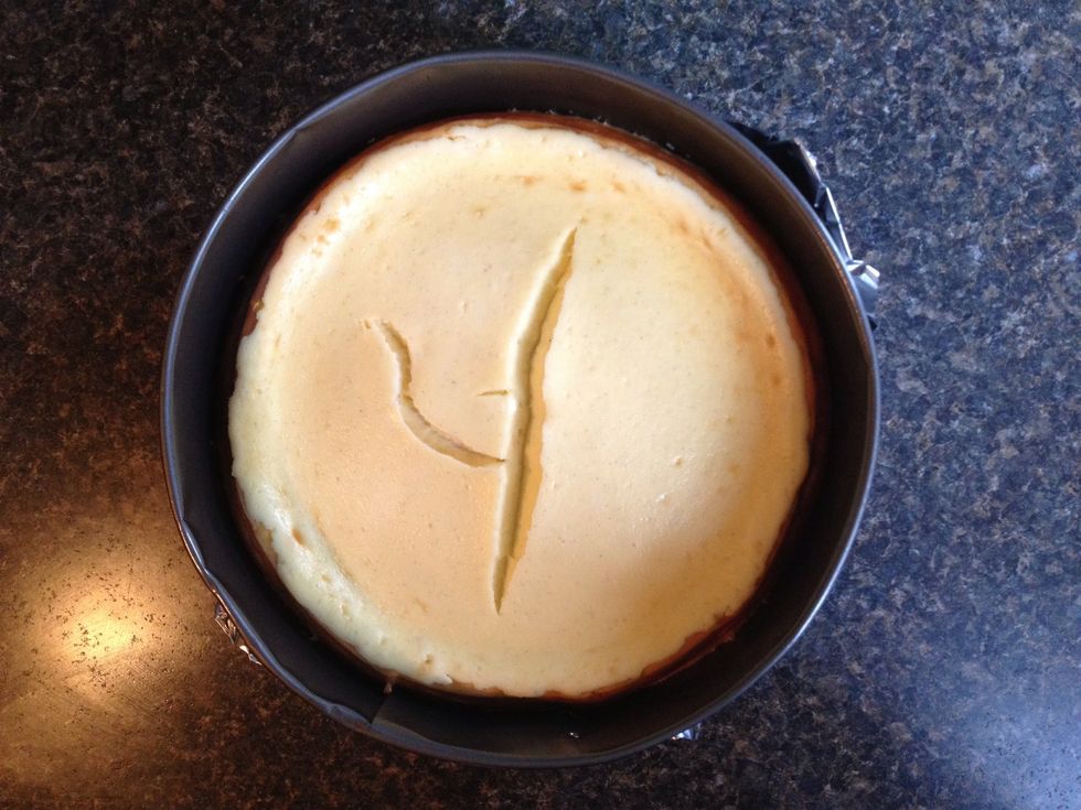 When the cheesecake reaches the baking time, turn the oven off. Don't check it, don't open the oven door. Let it cool in the oven for about 2 hours.