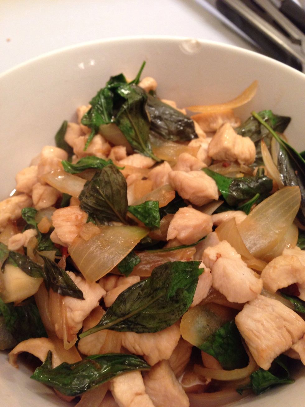 When the chicken is done add a dash of sesame oil and the Thai basil but just mix it for a couple of seconds before you put it on a plate or - as I did - in a bowl.