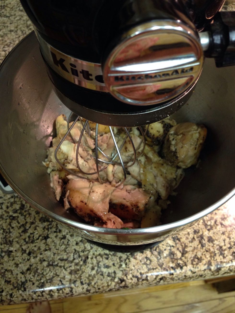 When the chicken is done, throw it in the mixer to shred it. Turn the speed on 2 for about 10 seconds for perfectly shredded meat. Or shred it with a fork