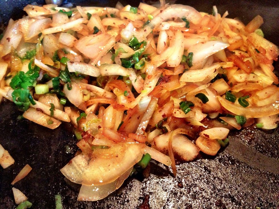When the chicken & sausage are finished & removed from pan, add 2 tbsp water to deglaze the pan, then toss in green onions & Visalia onion, cooking until tender.