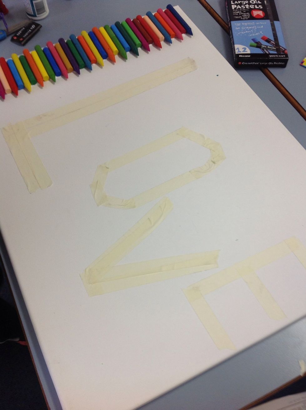 When the crayons are dry you can use masking tape to make a word