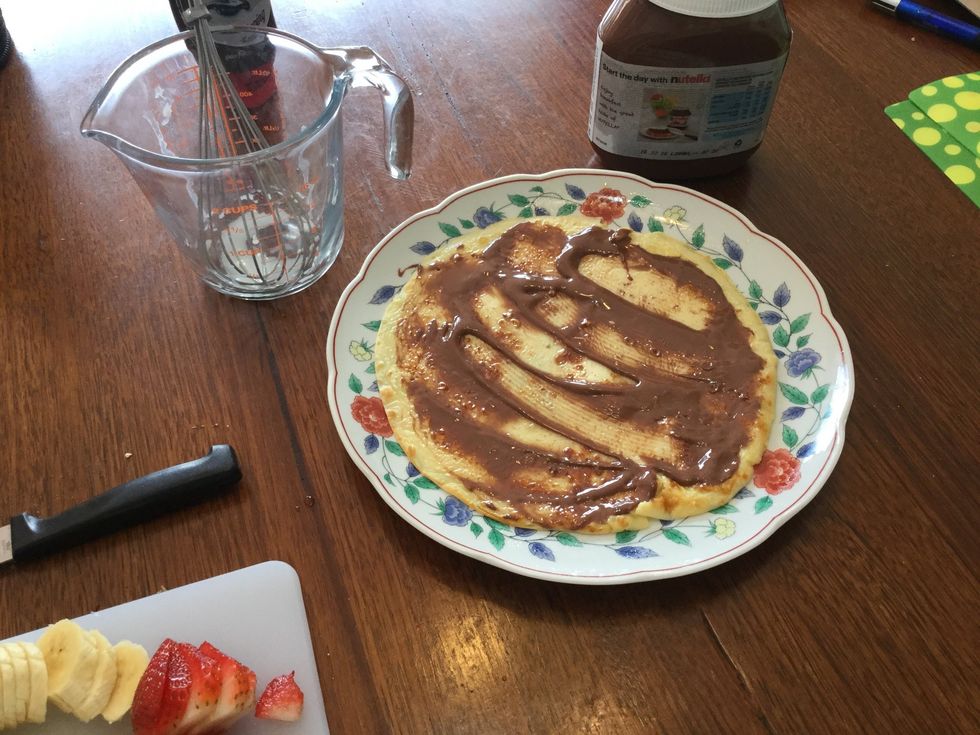 When the crepe is done add Nutella to one side of your crepe with a butter knife while it's nice and warm.