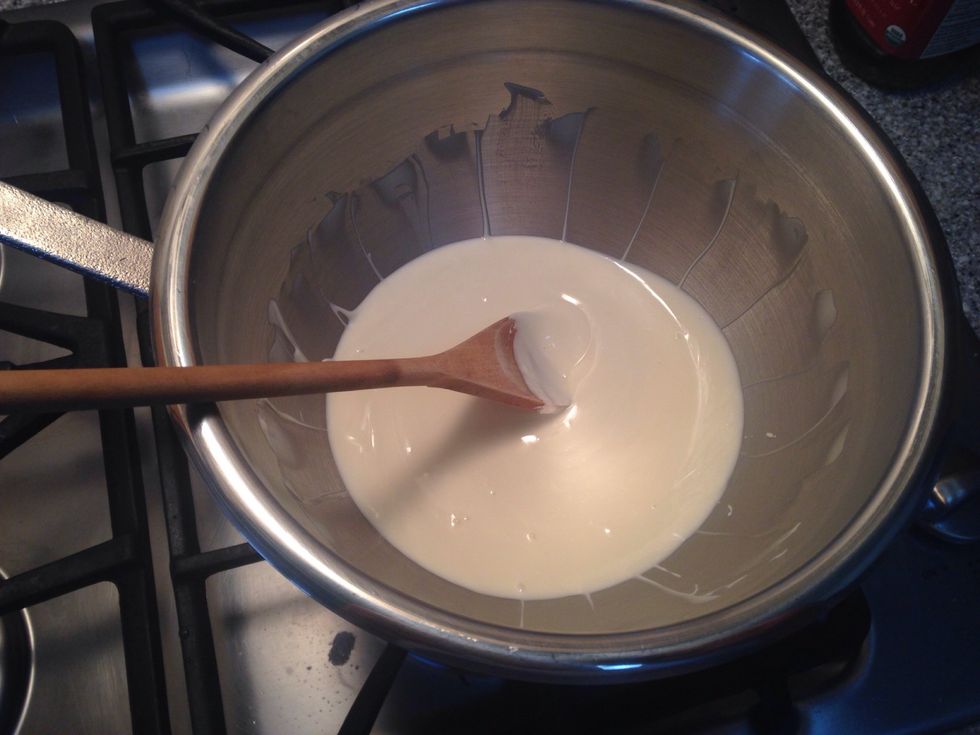 When the dark chocolate has firmed up, melt the white chocolate in a metal bowl over a pot of simmering water till completely melted.