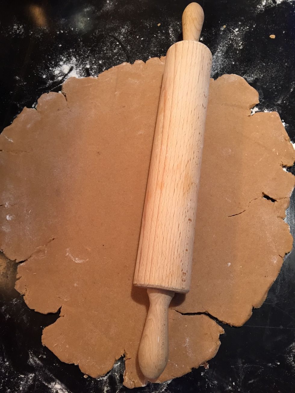 When the dough has chilled, tip the dough out onto a lightly floured surface and roll out until it is around 0.3 cm thick.