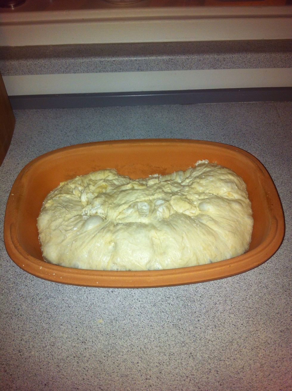 When the dough is done proving, carefully put it in the hot pot. Be careful not to puncture the dough. Put on the hot lid and put the pot in the oven. Let it cook for 30 minutes.