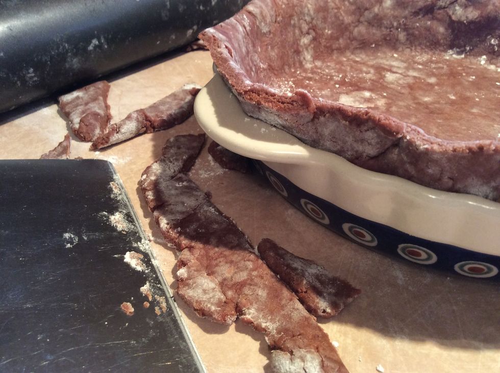 When the dough is fitted into the pie plate, it's time to trim off the extra dough. Leave about a 1/2- an inch of dough sticking out of the plate. Use a scissor, dough scraper or paring knife to trim.