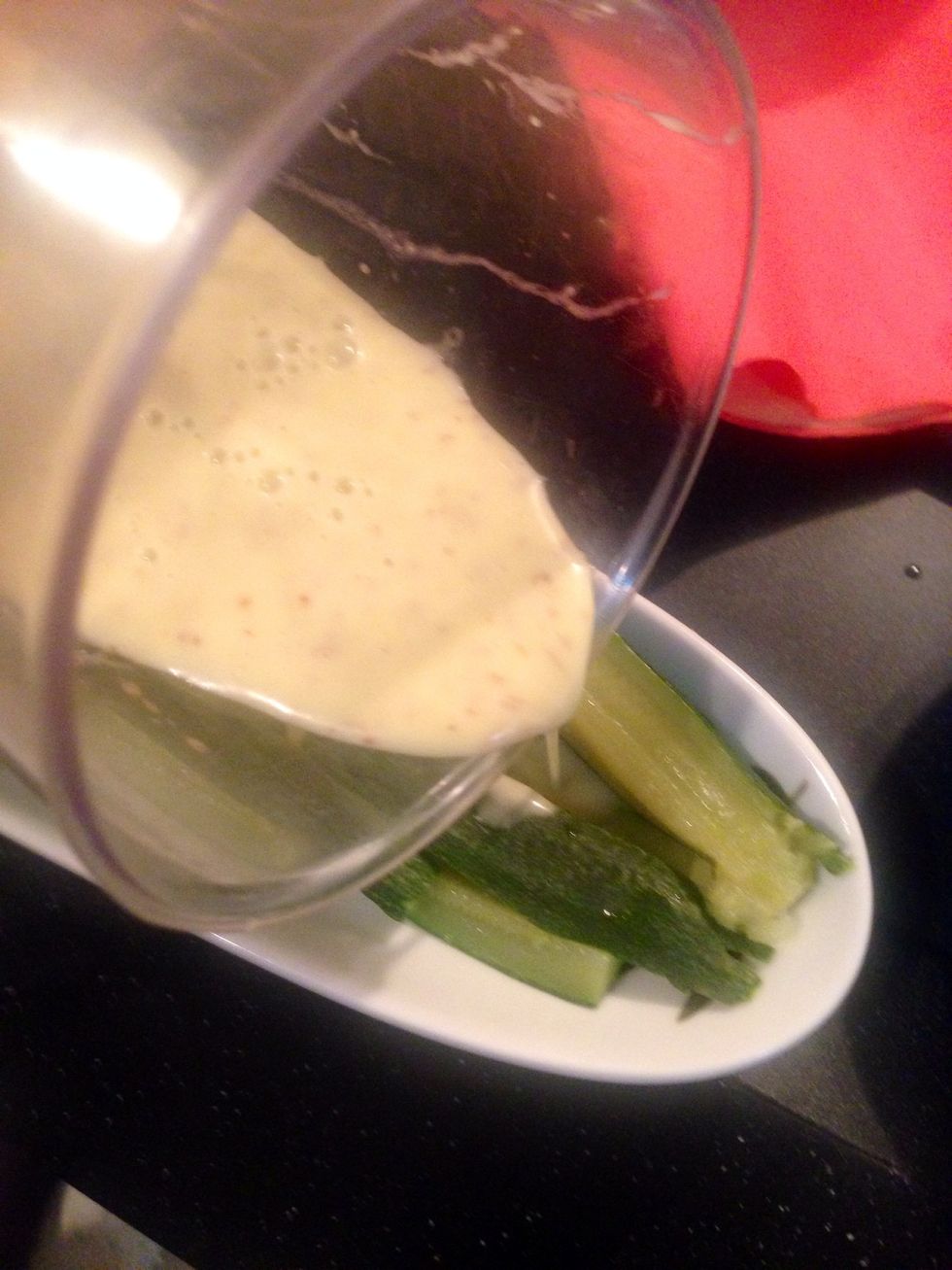 When the dressing is ready, pourit on the zucchini which is still warm