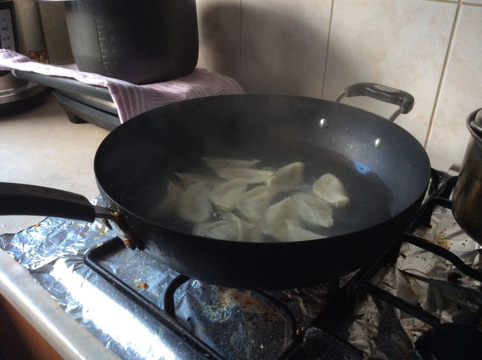 When the dumplings boil add a cup of water in. Repeat this 3 times.