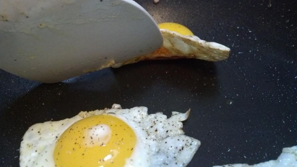When the edges of the egg are starting to lightly brown check underneath the egg to make sure bottom is also slightly brown letting you know they are cooked.