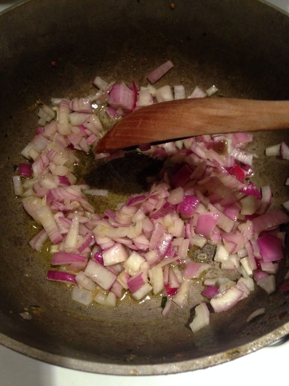 When the EVOO is hot, add in the onion and cook for about three minutes.