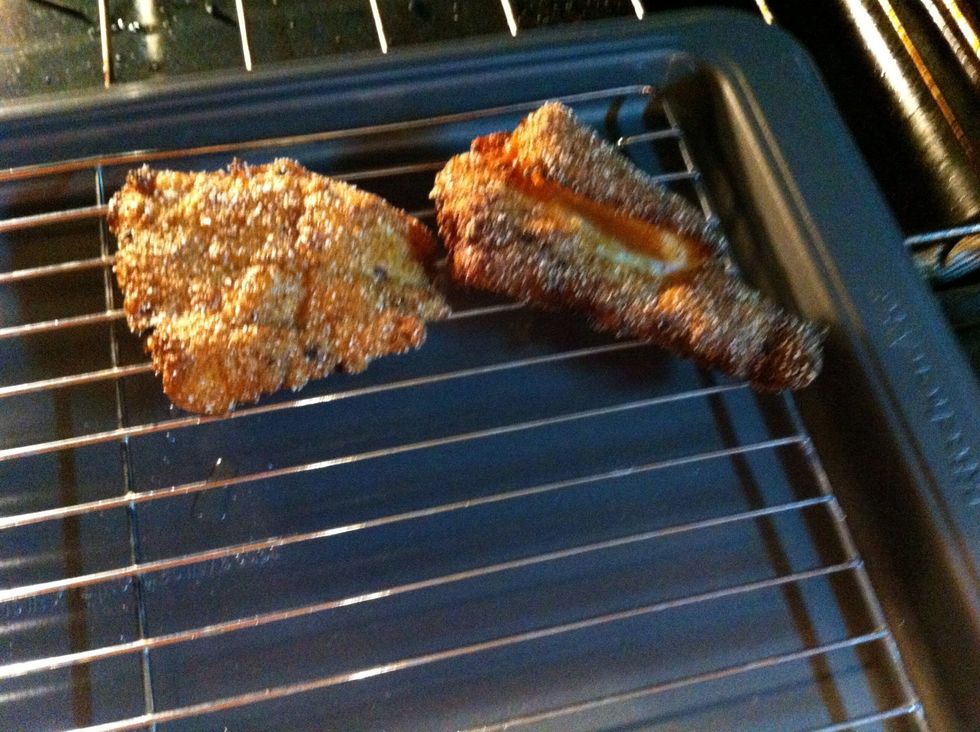 When the fish is done, place on your tray in the oven to allow the fish to drain and stay warm until its all done.