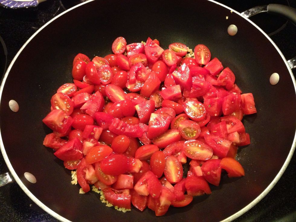 When the garlic has just begun to turn golden, add your tomatoes.