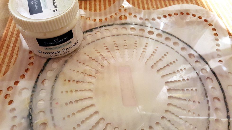 When the gesso was dry, I found a stencil, and used Faber Castell`s Whipped Spackle over it.