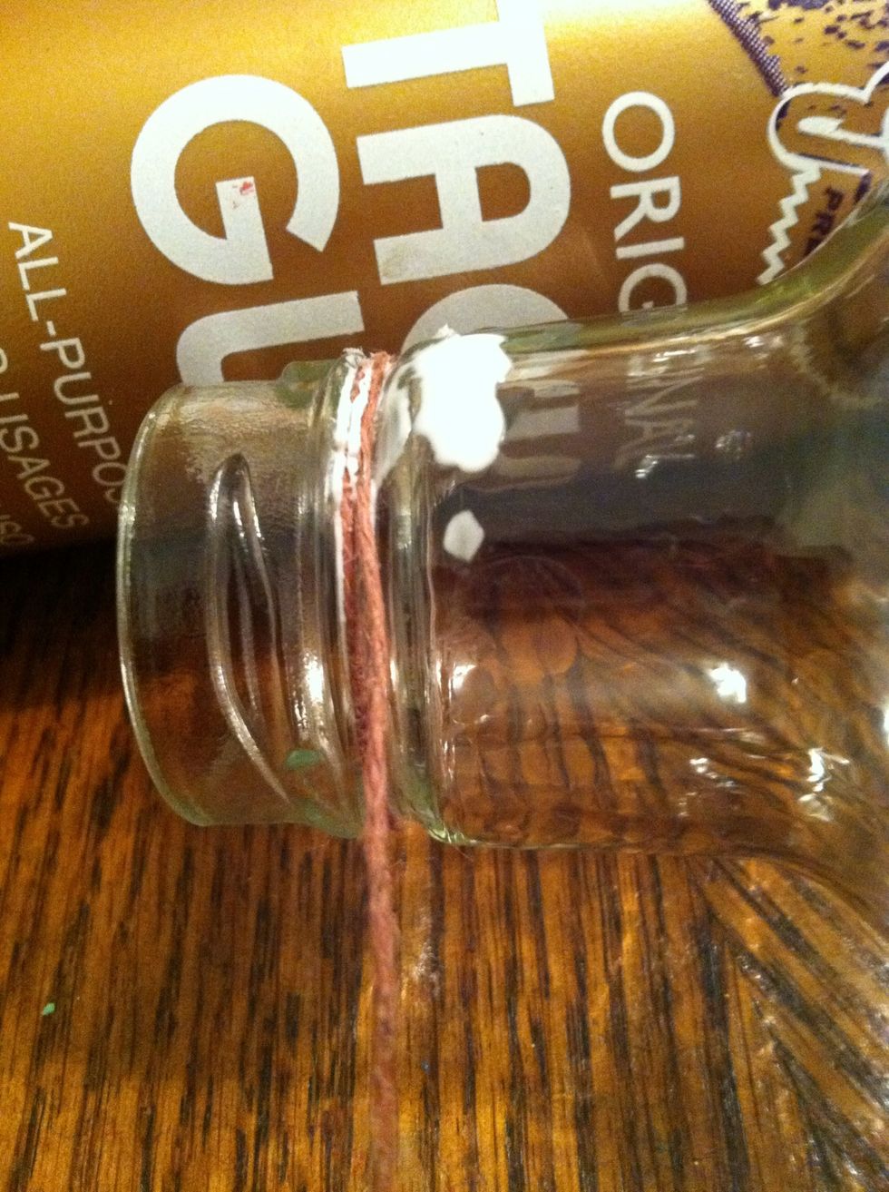 When the glue starts to hold but isn't yet dry, begin wrapping. Add a dot of glue for ever 5 or so wraps. Remember to keep it tight. And push up as you go.