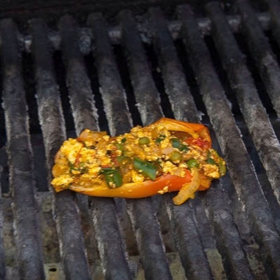When the grill is hot, place the stuffed peppers on it and grill them until the Paneer vegetable mixture starts to brown. This is not a terrific picture as the heat was intense.