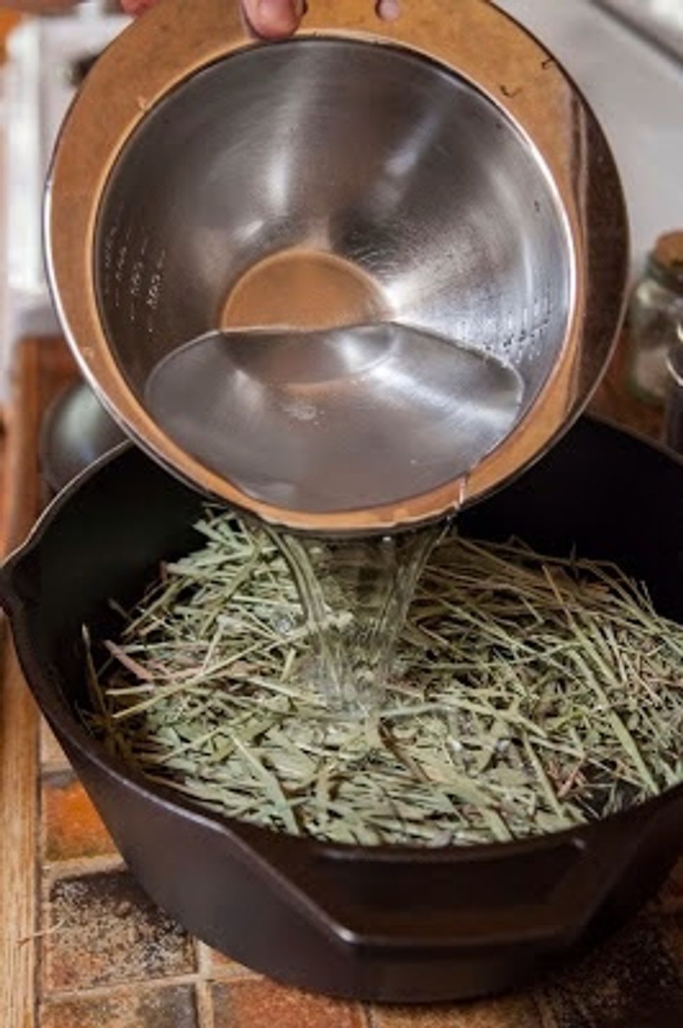 When the hay smokes a bit, pour 1 qt of water mixed with 2 Tbs of salt over the hay.