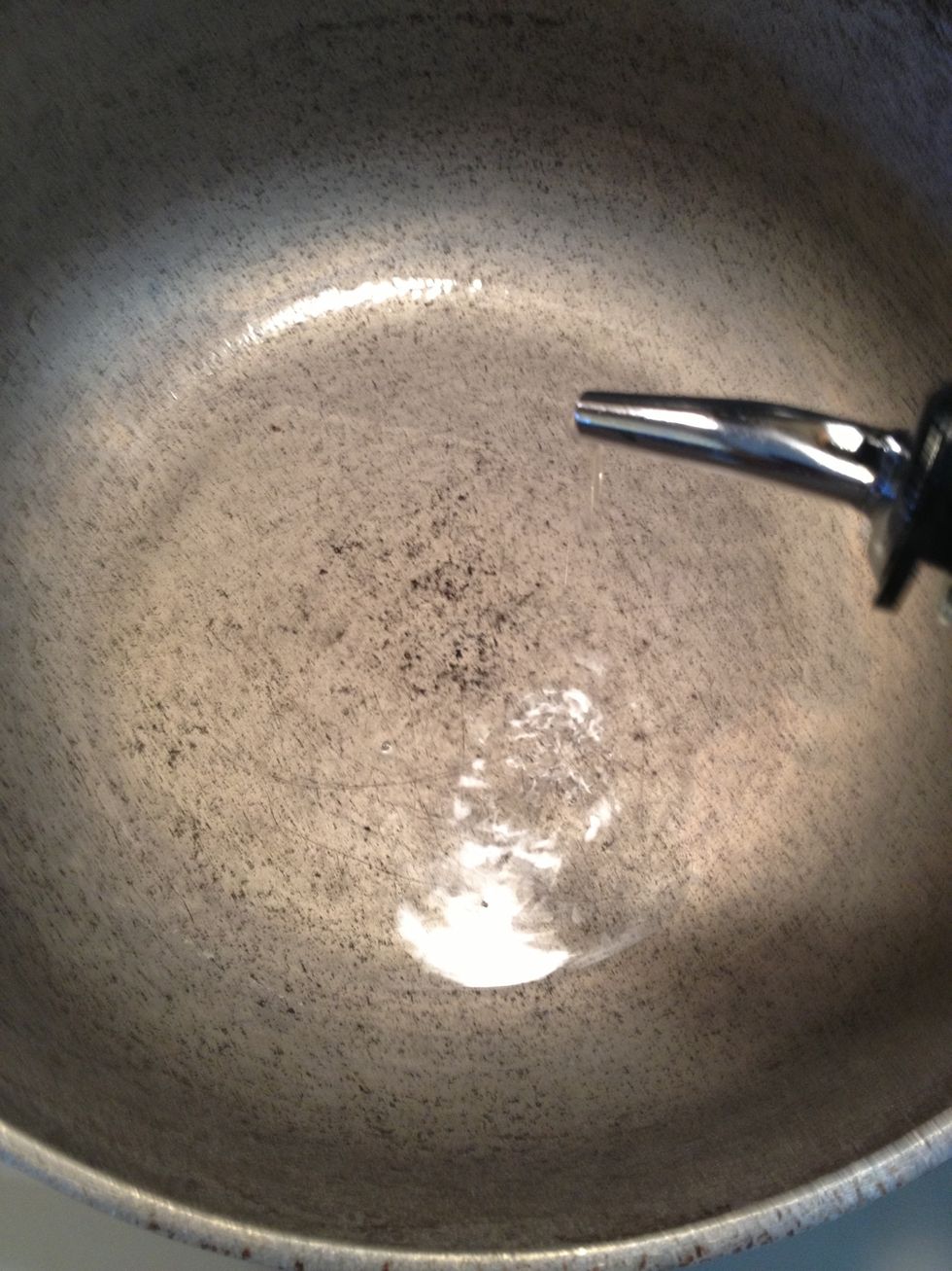 When the hr. or night has passed . Take the chicken out of fridge & bring to room temp. When it has reached rm. temp take a lge pot & place it on the stove burners over medium heat. Add 2 tbs of oil.