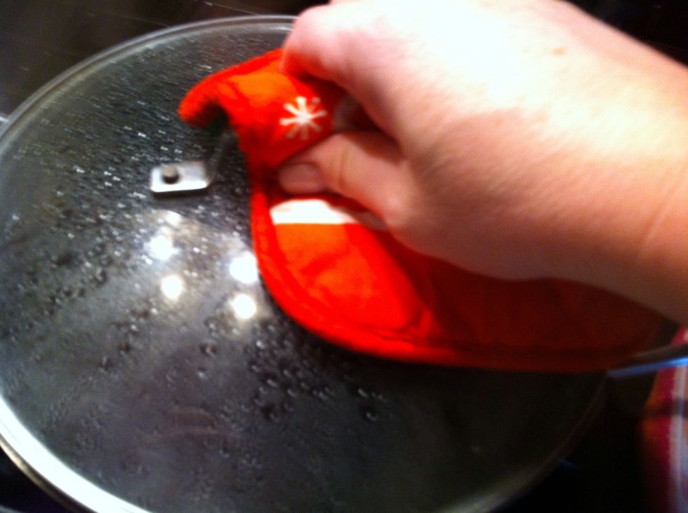 When the juice has come back to boil, remove lid.