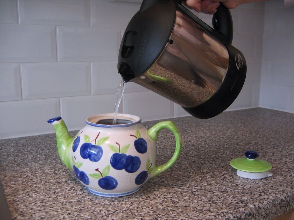 When the kettle has boiled fill the teapot with water.