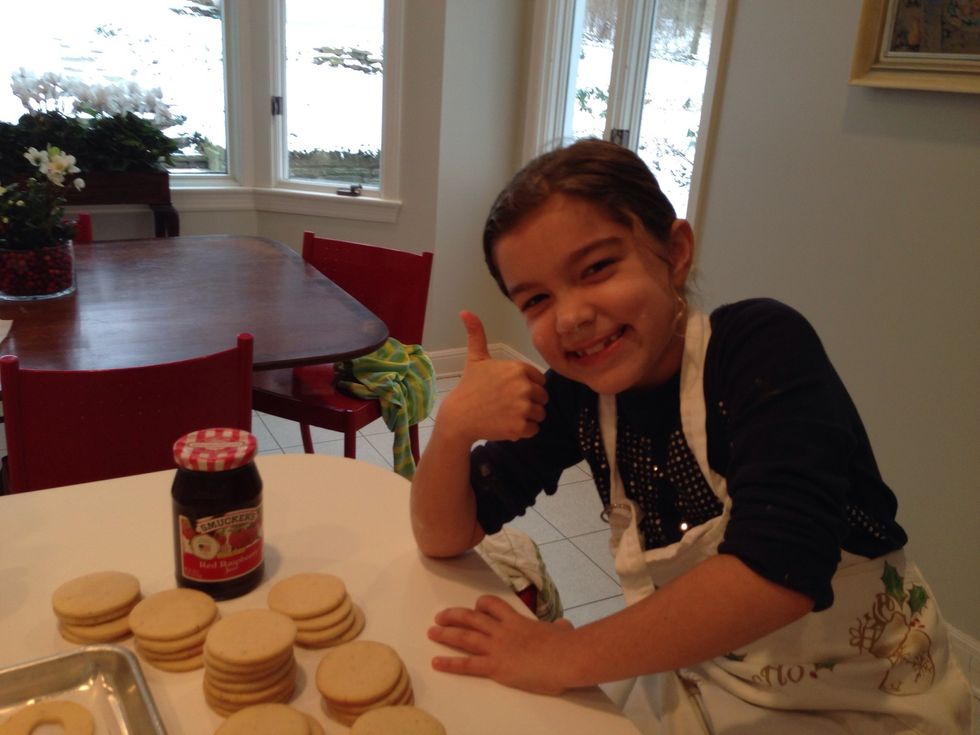 When the Linzers have cooled, get out the seedless raspberry jam and 2 good spreading knives. I don't know how Hildegard got that flour on her nose.
